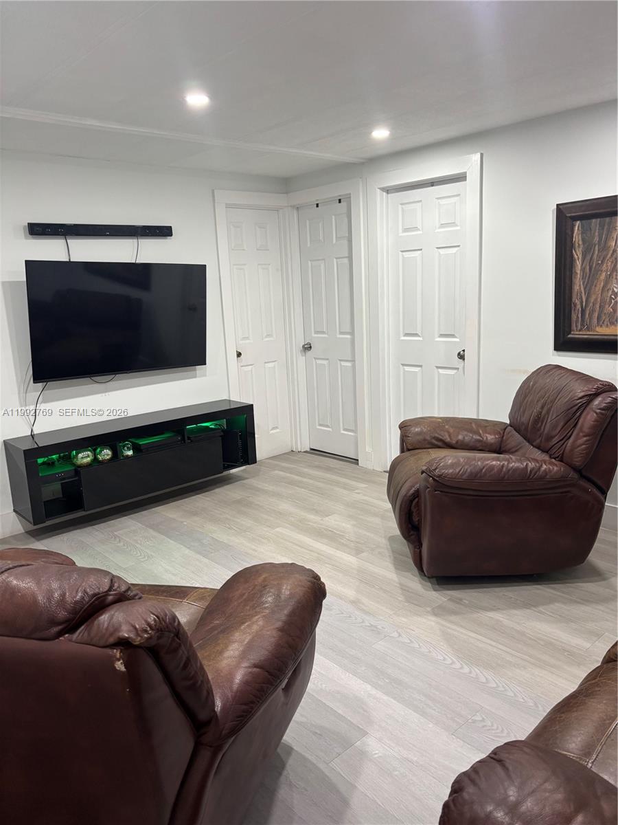 12888 Southwest 17th Street Miami, FL 33175 - Photo 15 of 19 a living room with furniture and a flat screen tv