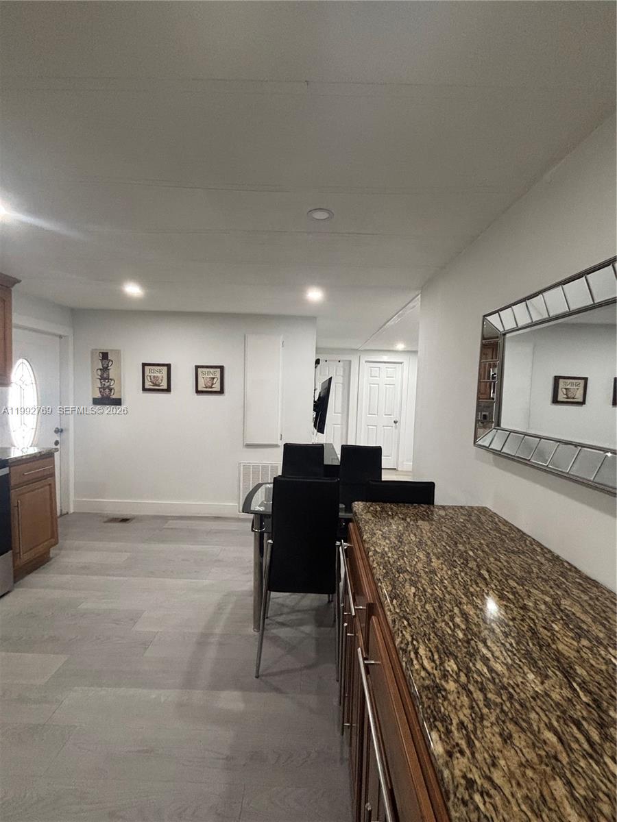 12888 Southwest 17th Street Miami, FL 33175 - Photo 17 of 19 a view of a kitchen and living room