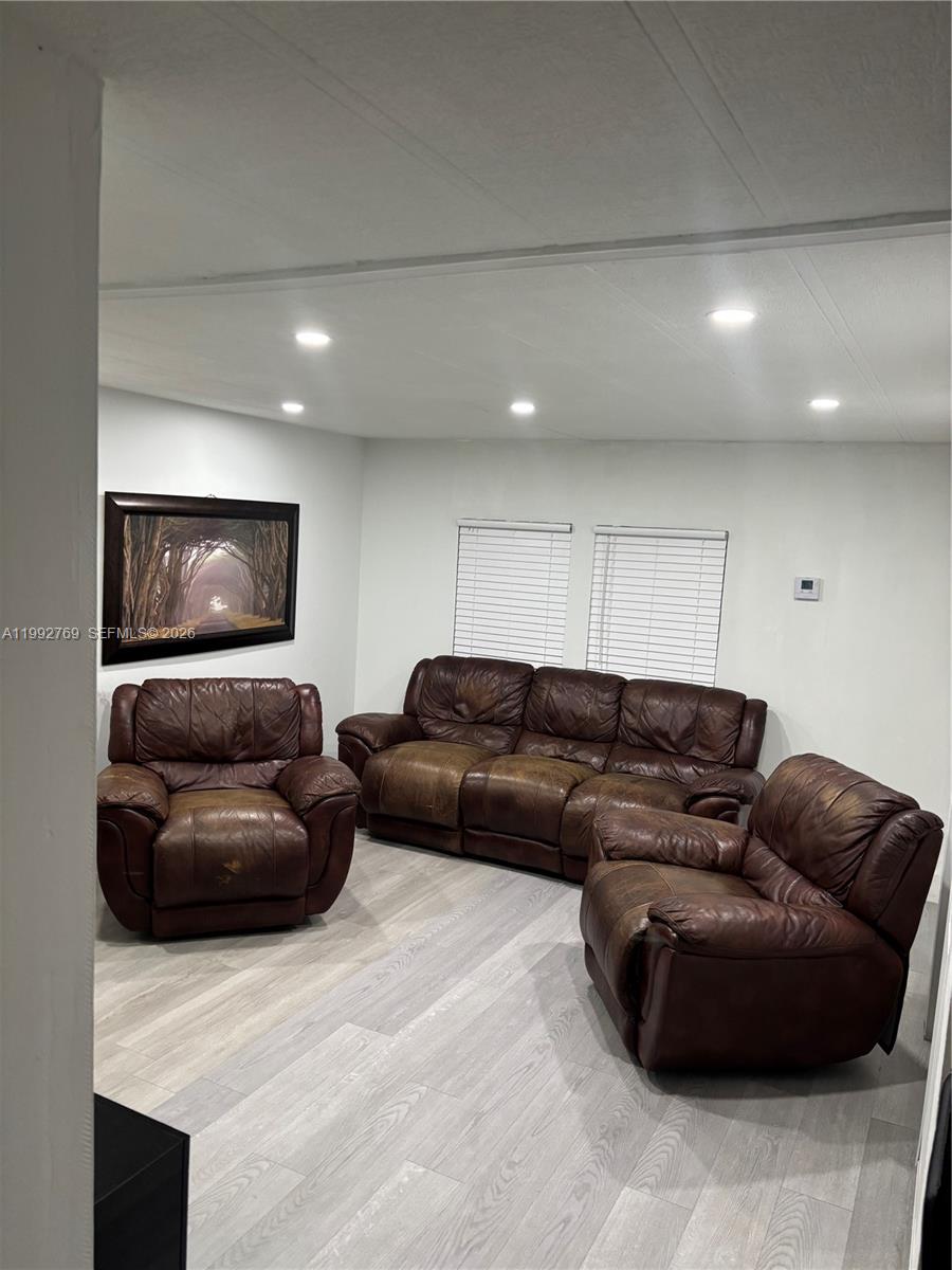12888 Southwest 17th Street Miami, FL 33175 - Photo 18 of 19 a living room with furniture and a flat screen tv