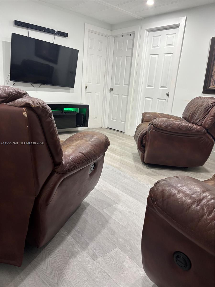 12888 Southwest 17th Street Miami, FL 33175 - Photo 5 of 19 a bedroom with a bed and a couch