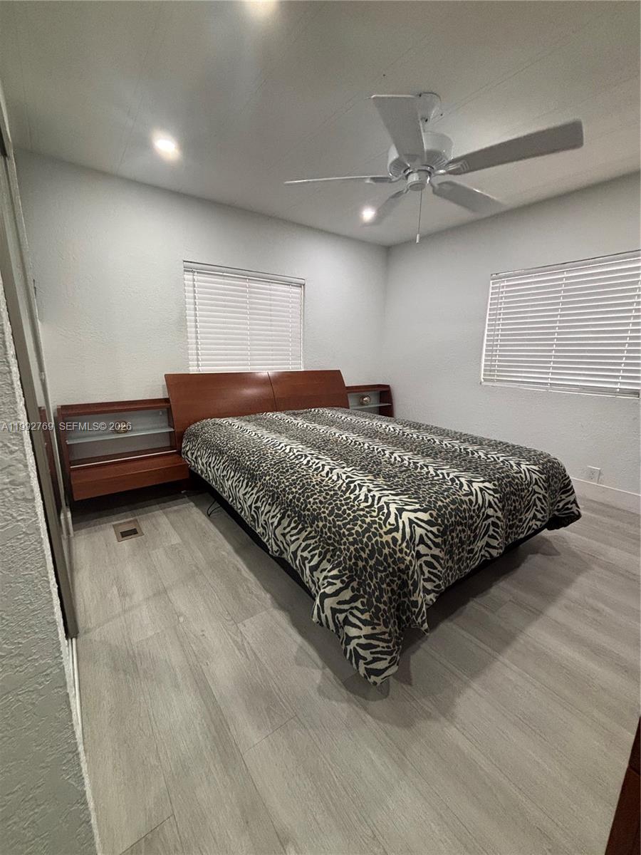 12888 Southwest 17th Street Miami, FL 33175 - Photo 7 of 19 a bed sitting in a room next to a window