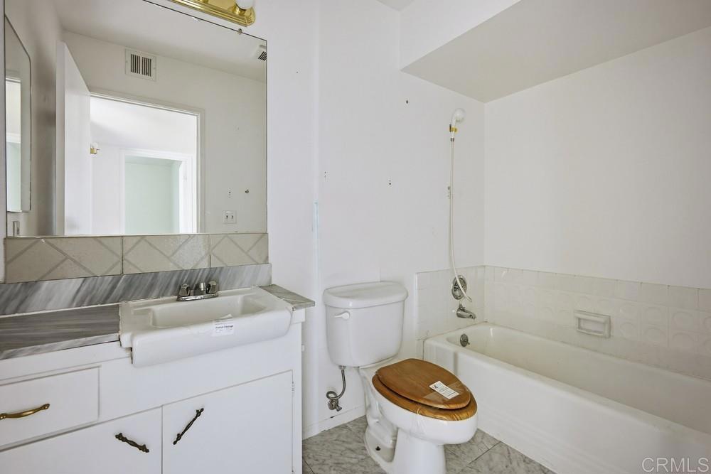 27077 El Rancho Road Menifee, CA 92586 - Photo 23 of 31 a bathroom with a sink a toilet and a bathtub