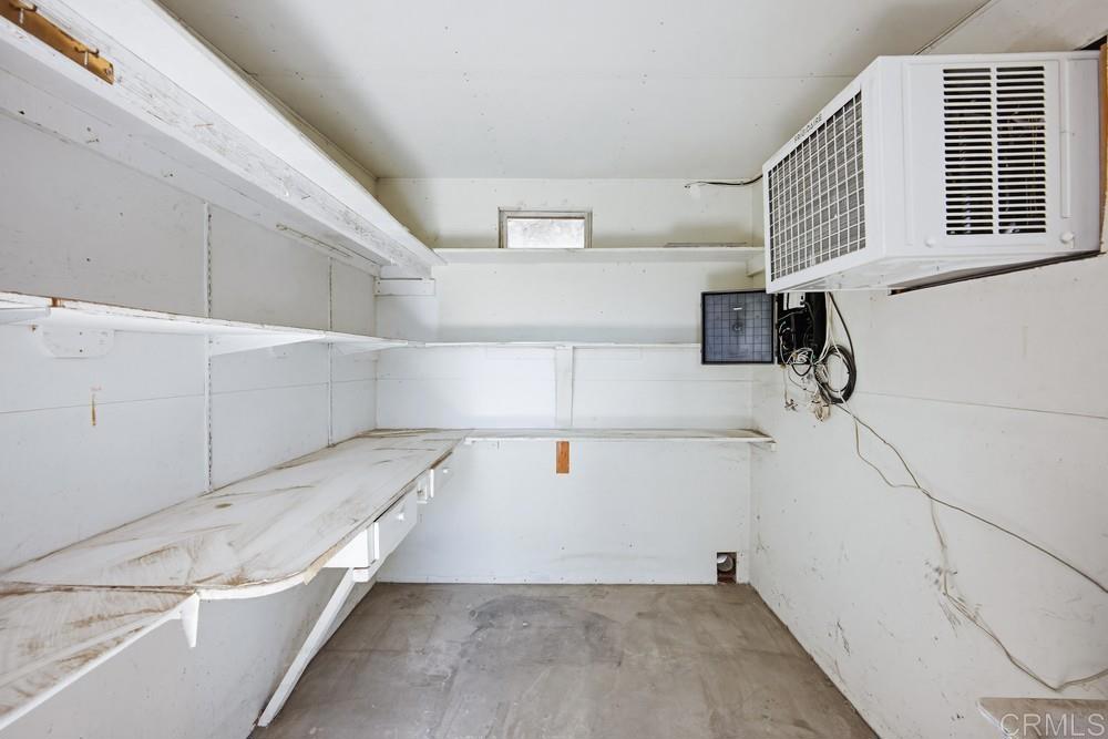 27077 El Rancho Road Menifee, CA 92586 - Photo 25 of 31 a view of storage and utility room with washer and dryer