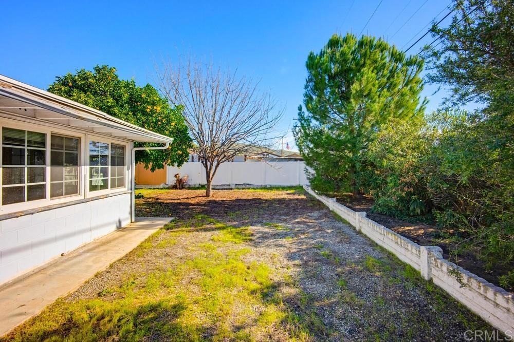 27077 El Rancho Road Menifee, CA 92586 - Photo 28 of 31 a view of a backyard with plants and large trees