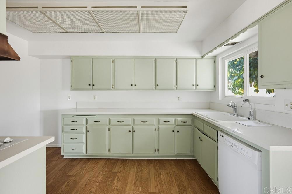 27077 El Rancho Road Menifee, CA 92586 - Photo 7 of 31 a view of cabinets a wooden floor tub and sink