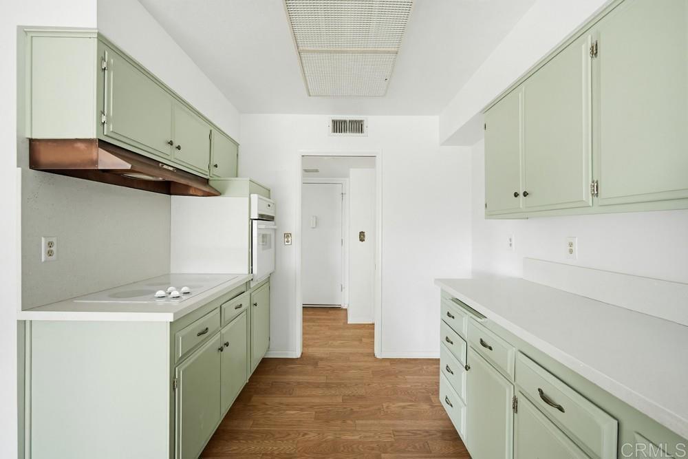 27077 El Rancho Road Menifee, CA 92586 - Photo 9 of 31 a kitchen with stainless steel appliances a sink and a refrigerator