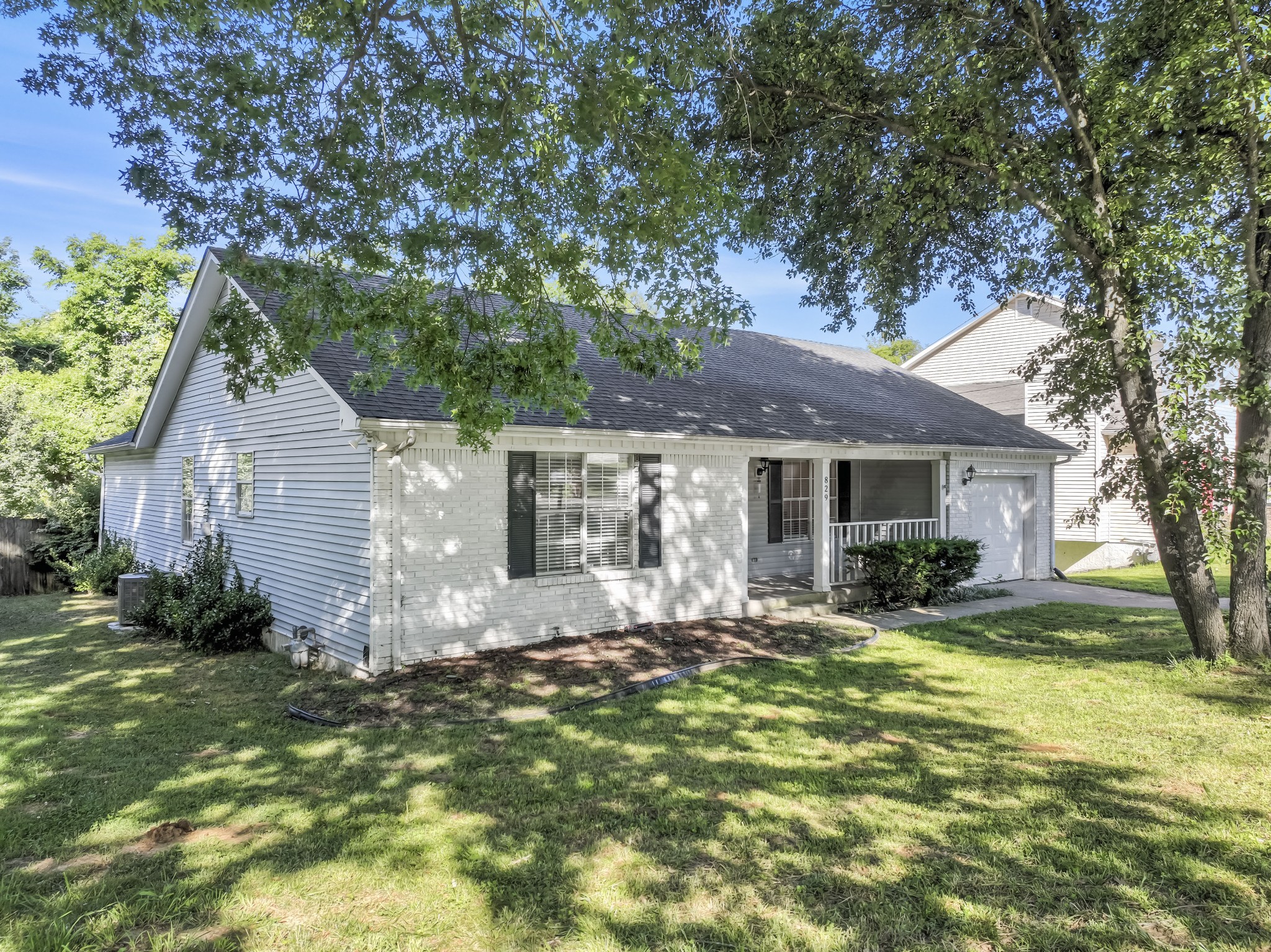 829 Bishopsgate Road Antioch, TN 37013 - Photo 1 of 18 a front view of house with yard and green space