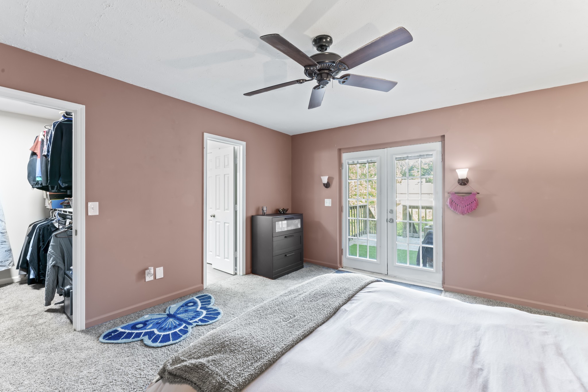 829 Bishopsgate Road Antioch, TN 37013 - Photo 16 of 18 a bedroom with a bed and a chandelier