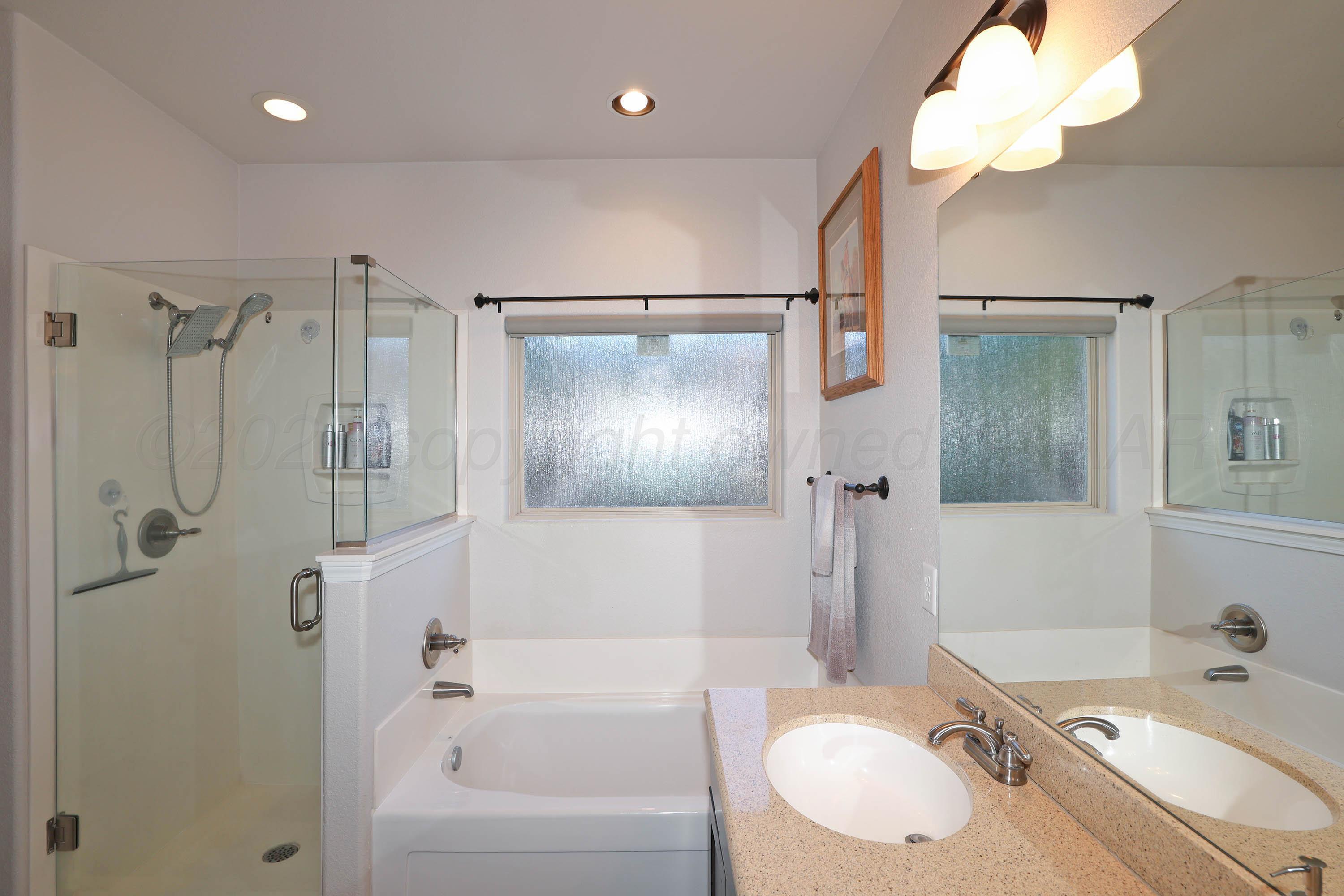 1003 Cabernet Way Amarillo, TX 79124 - Photo 20 of 36 a bathroom with a sink a toilet and shower