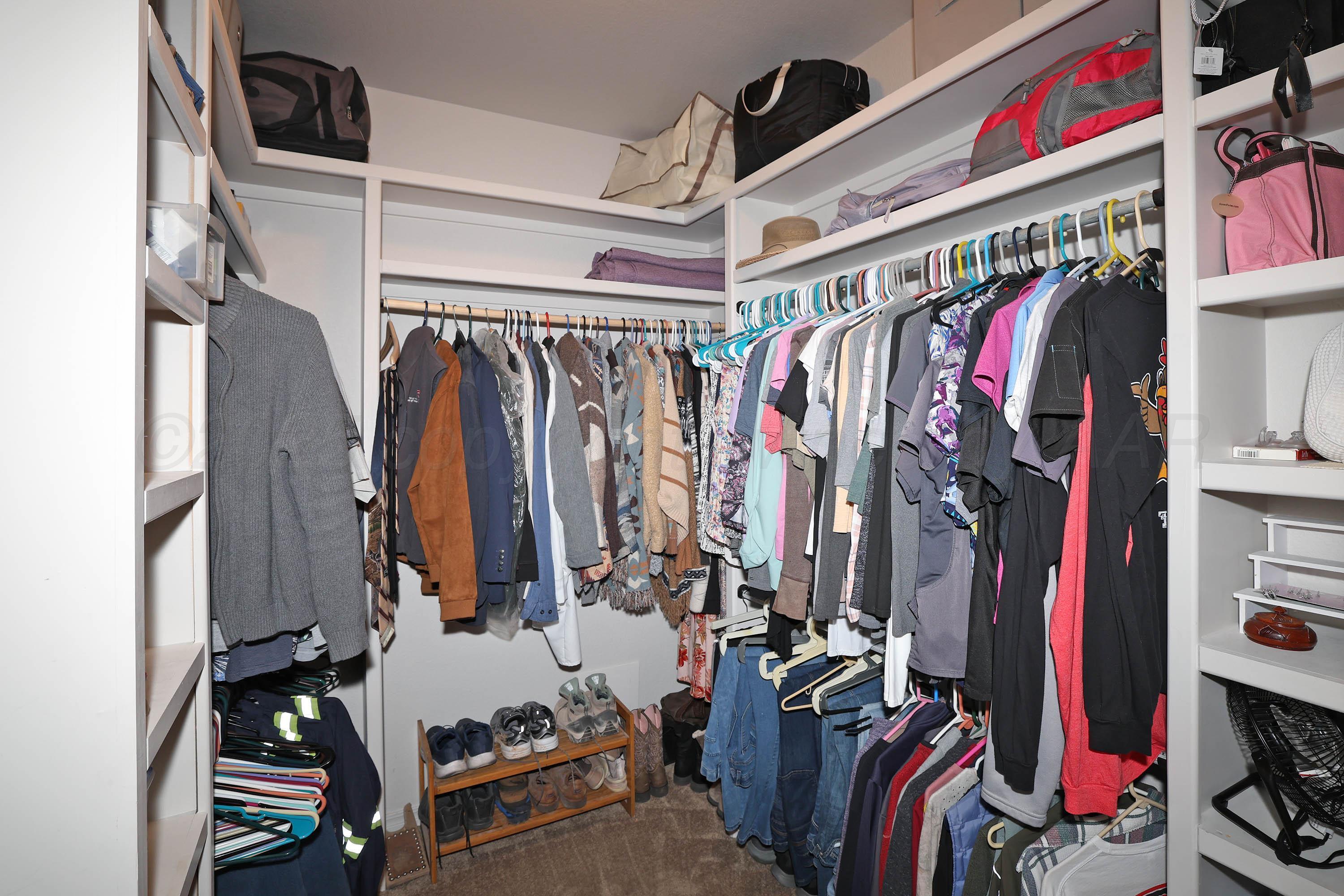 1003 Cabernet Way Amarillo, TX 79124 - Photo 22 of 36 a view of walk in closet with clothes