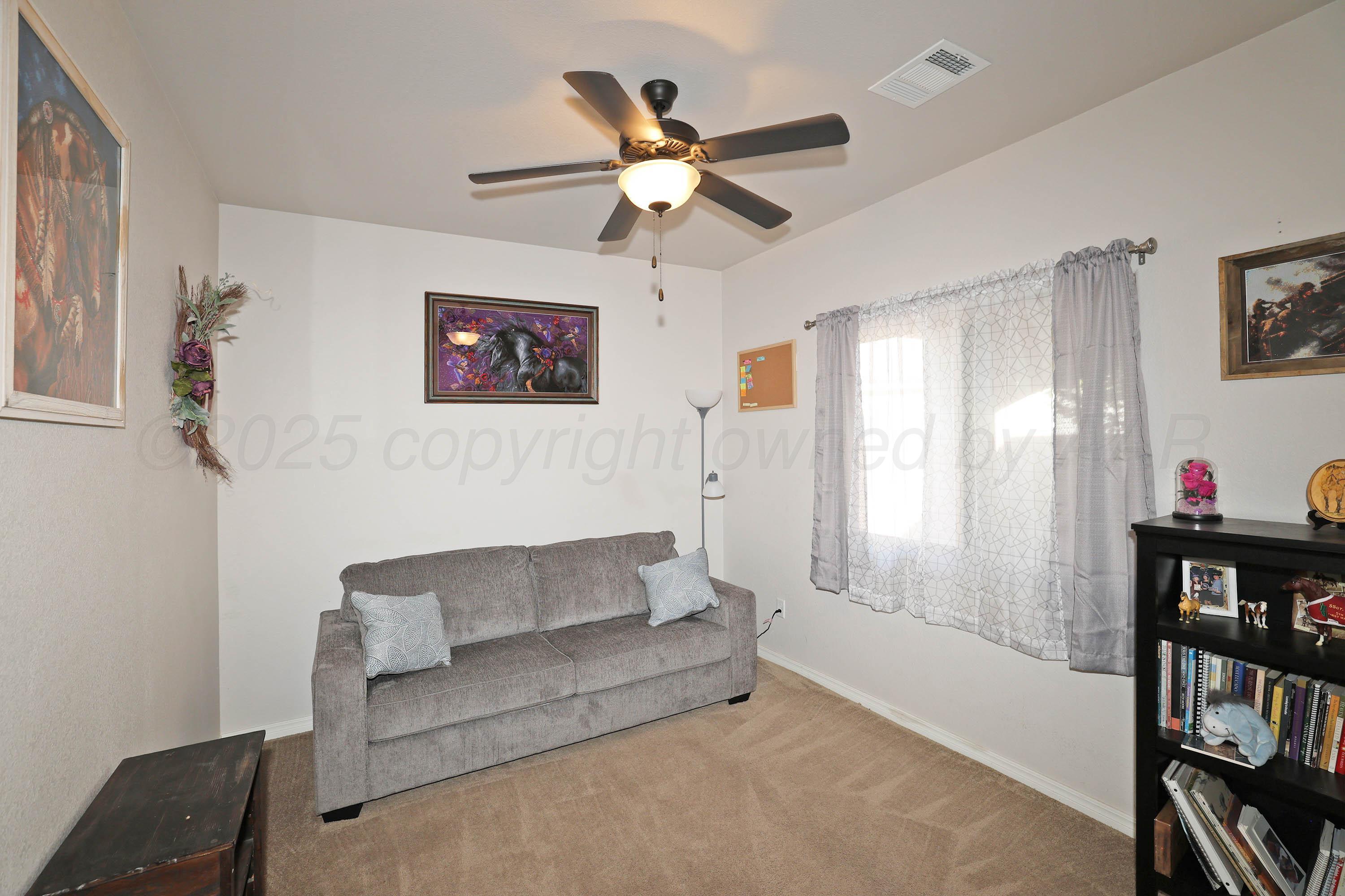 1003 Cabernet Way Amarillo, TX 79124 - Photo 23 of 36 a living room with furniture and a window