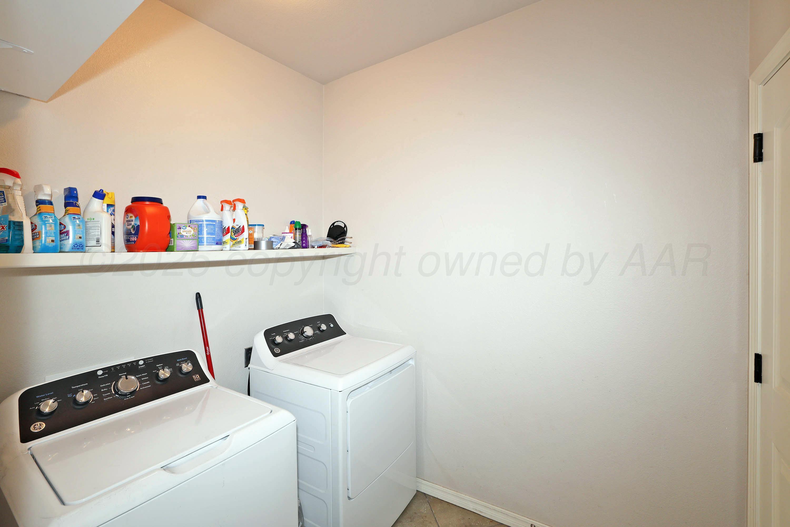 1003 Cabernet Way Amarillo, TX 79124 - Photo 30 of 36 a room with storage and utility