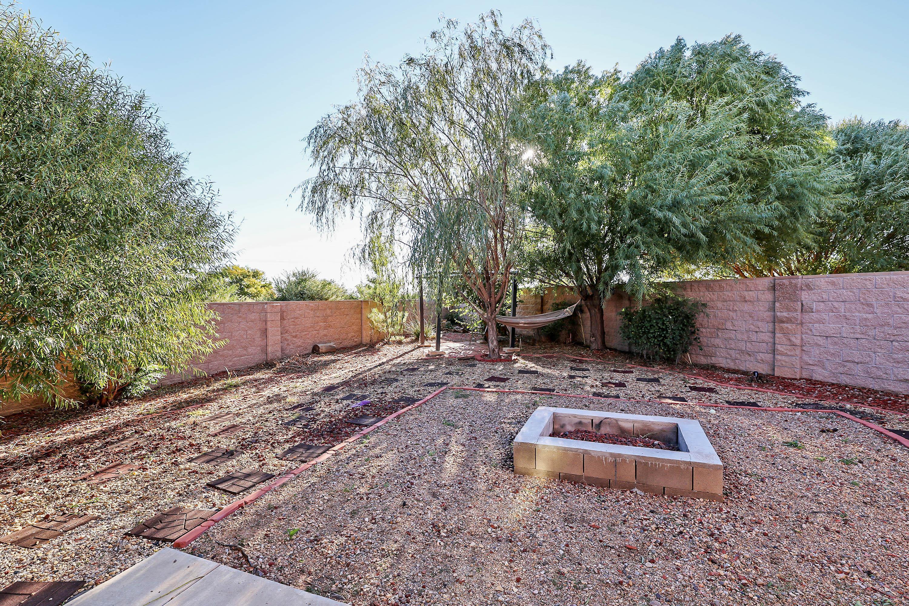 1003 Cabernet Way Amarillo, TX 79124 - Photo 35 of 36 a view of a backyard with large trees