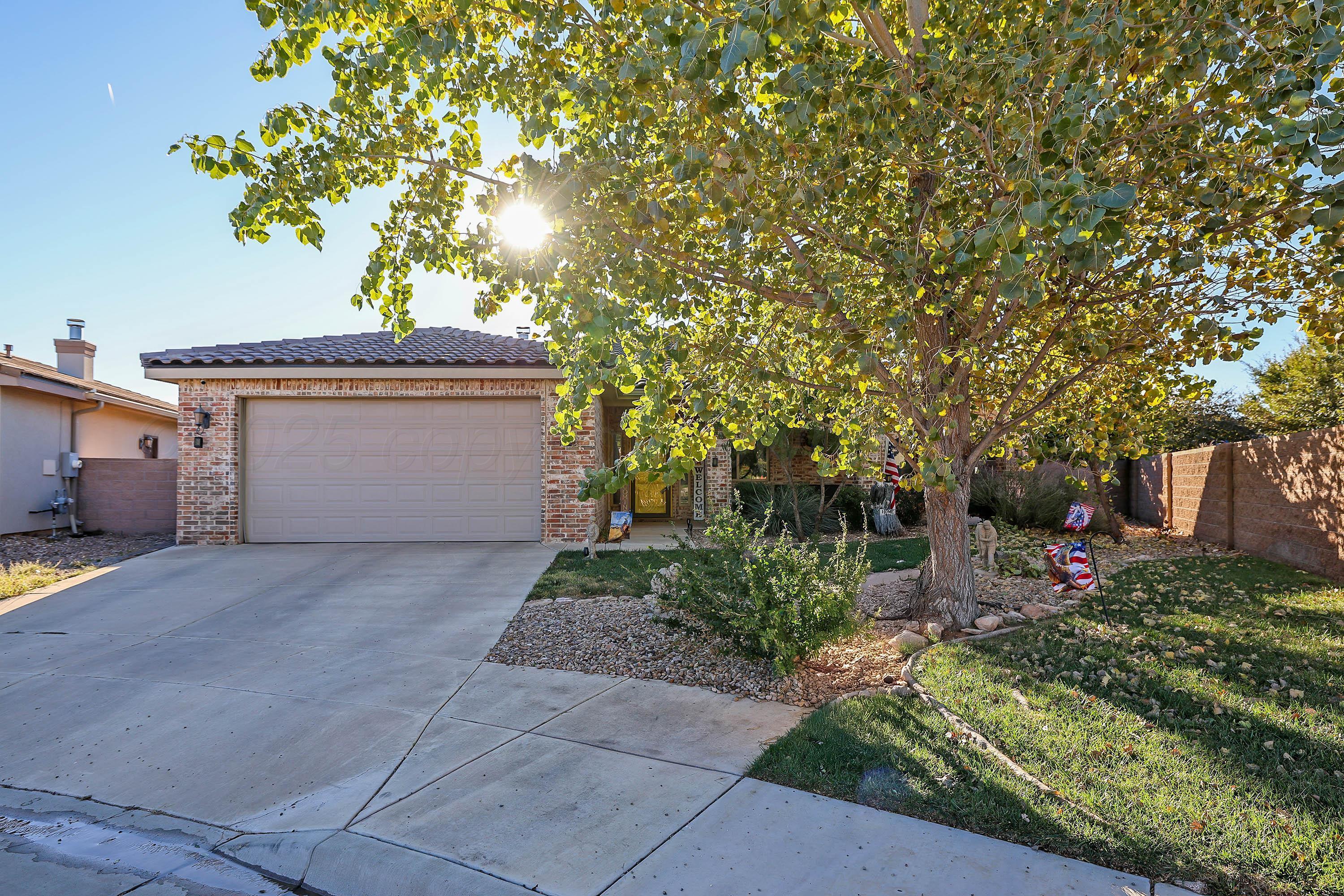 1003 Cabernet Way Amarillo, TX 79124 - Photo 5 of 36 a view of a house with a tree and plants