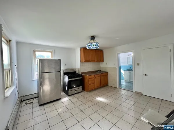 a kitchen with stainless steel appliances a refrigerator and a sink