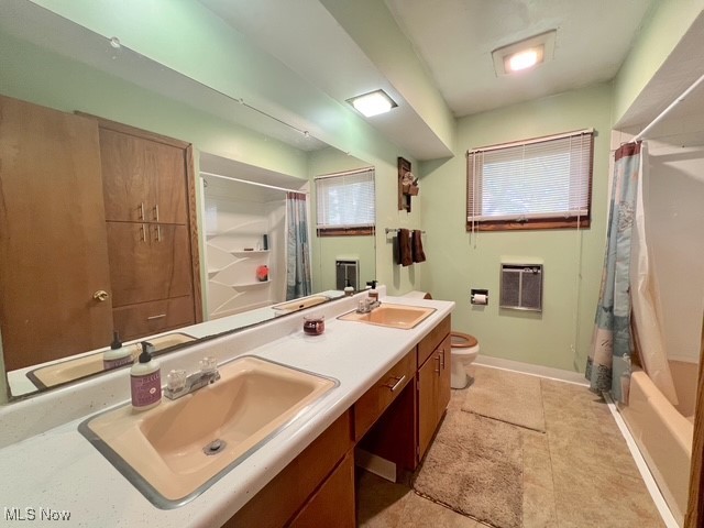 6852 Riverside Road Southeast Uhrichsville, OH 44683 - Photo 11 of 30 Bathroom with double vanity, shower / bathtub combination with curtain, heating unit, and light tile patterned floors