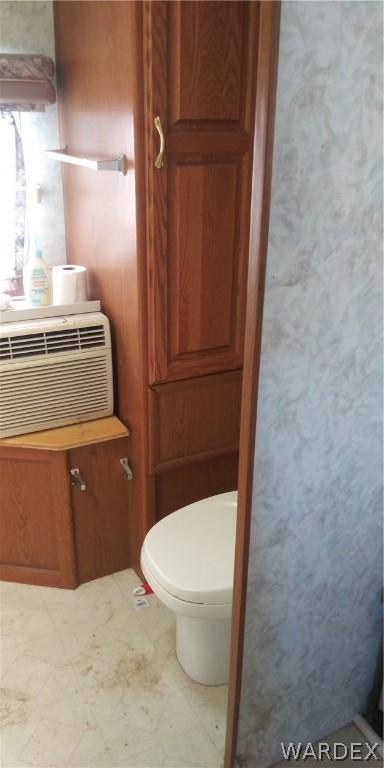 3313 Bowie Road Golden Valley, AZ 86413 - Photo 12 of 16 a bathroom with a toilet and a sink