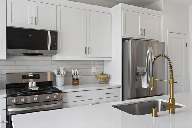 a bedroom with a bed and a flat screen television