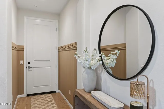 a bathroom with a double vanity sink mirror and shower