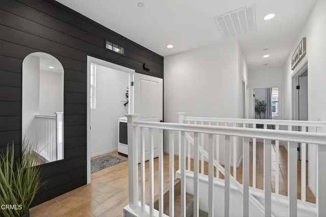 a bathroom with double sink and a mirror