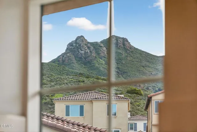 a room with furniture pool table and flat screen tv