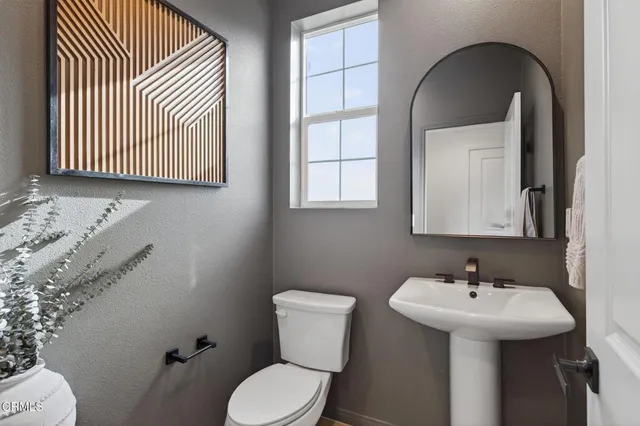 a view of a livingroom with furniture and windows