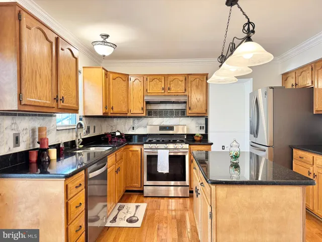 an empty room with a window and a ceiling fan