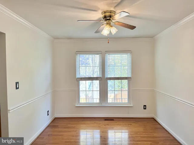 a view of a porch with furniture and floor to ceiling window