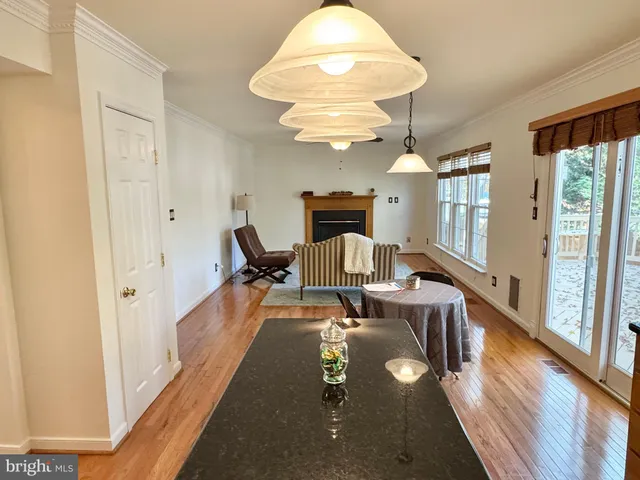 a view of an empty room and wooden floor