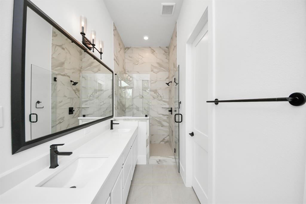 405 Forest Reserve Place Houston, TX 77079 - Photo 26 of 38 Primary bathroom showcasing the gorgeous walk in shower