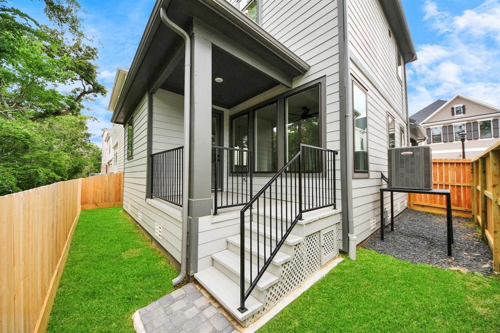 405 Forest Reserve Place Houston, TX 77079 - Photo 37 of 38 Backyard view highlighting the porch and green space