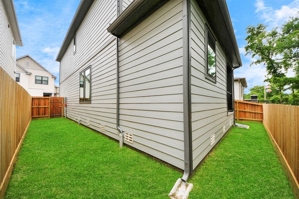 405 Forest Reserve Place Houston, TX 77079 - Photo 38 of 38 Another angle of the green space in the backyard