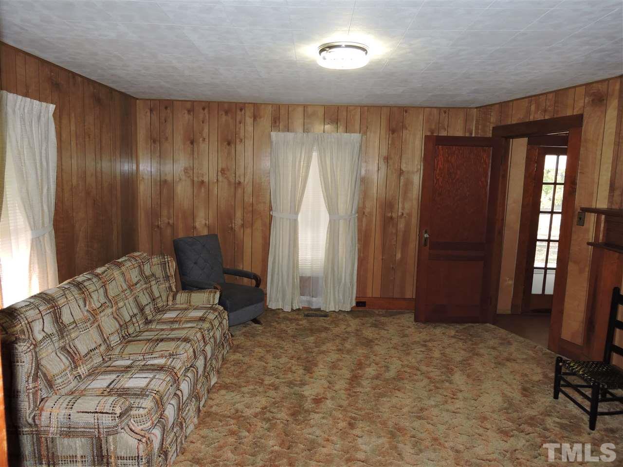 216 Red Mountain Road Rougemont, NC 27572 - Photo 6 of 7 a view of a livingroom with furniture and windows