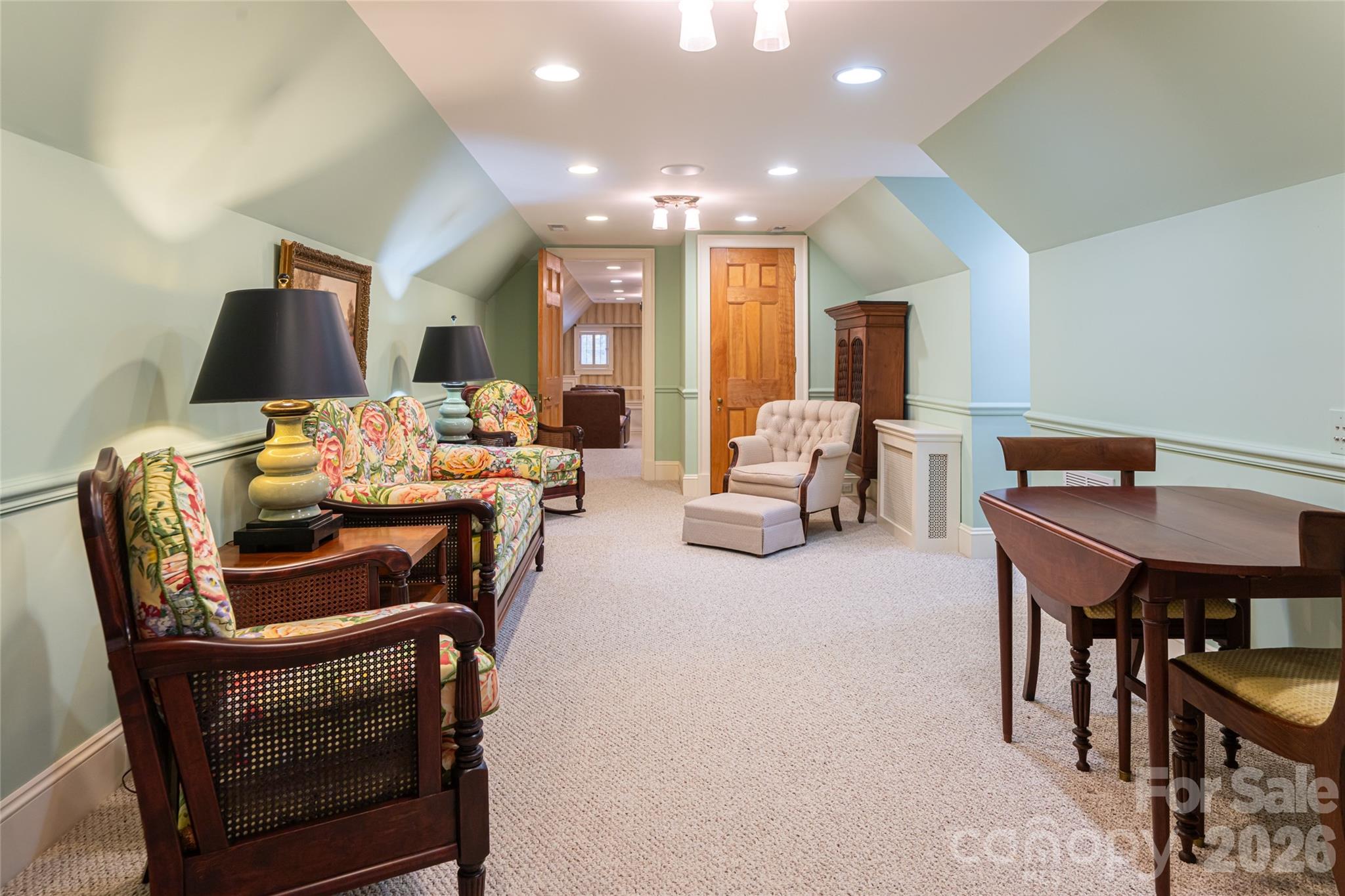 324 Vanderbilt Road Asheville, NC 28803 - Photo 39 of 48 a living room with furniture a flat screen tv and a table