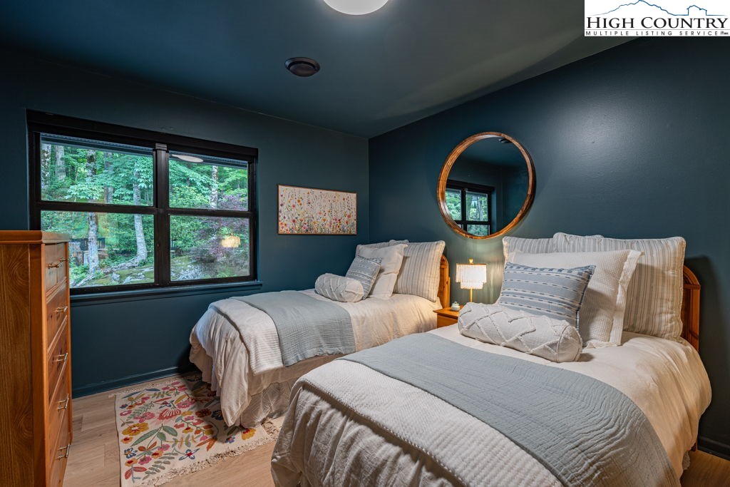 102 Ridge Drive Linville, NC 28646 - Photo 34 of 48 a bedroom with two beds and a large window