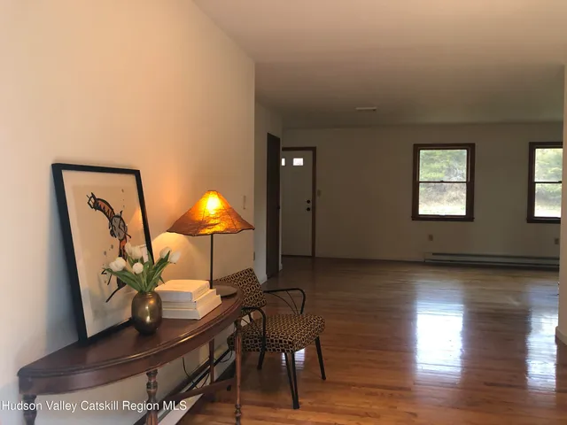 a room with furniture and wooden floor
