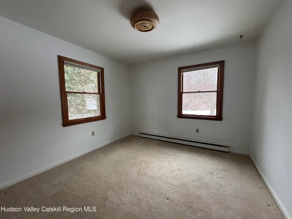 an empty room with windows