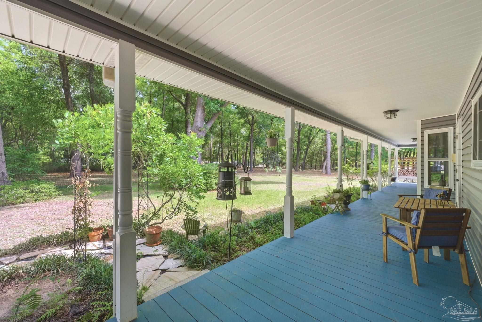 6930 Summit Way Milton, FL 32570 - Photo 45 of 71 a view of a room with wooden floor and outdoor space