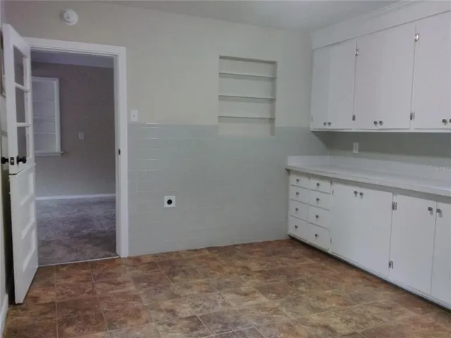 an empty room with a fireplace