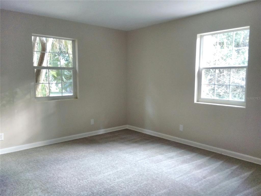 487 Rylane Street De Leon Springs, FL 32130 - Photo 20 of 40 an empty room with a window