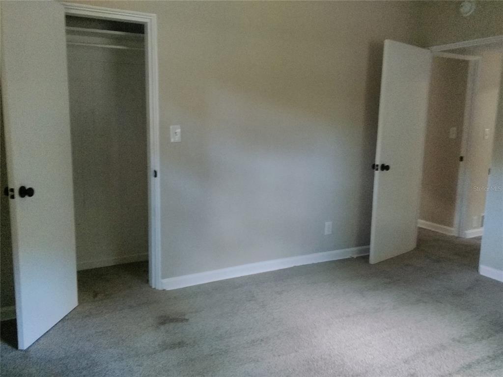 487 Rylane Street De Leon Springs, FL 32130 - Photo 21 of 40 an empty room with closet area