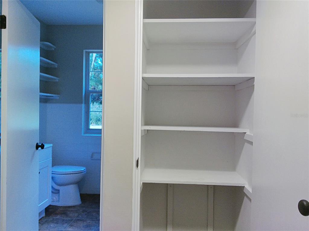 487 Rylane Street De Leon Springs, FL 32130 - Photo 25 of 40 a bathroom with a toilet