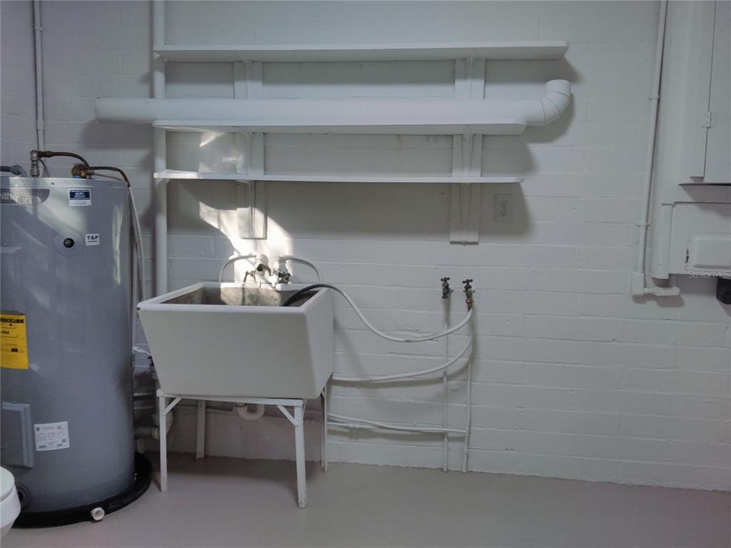 487 Rylane Street De Leon Springs, FL 32130 - Photo 27 of 40 a room with a table and chairs