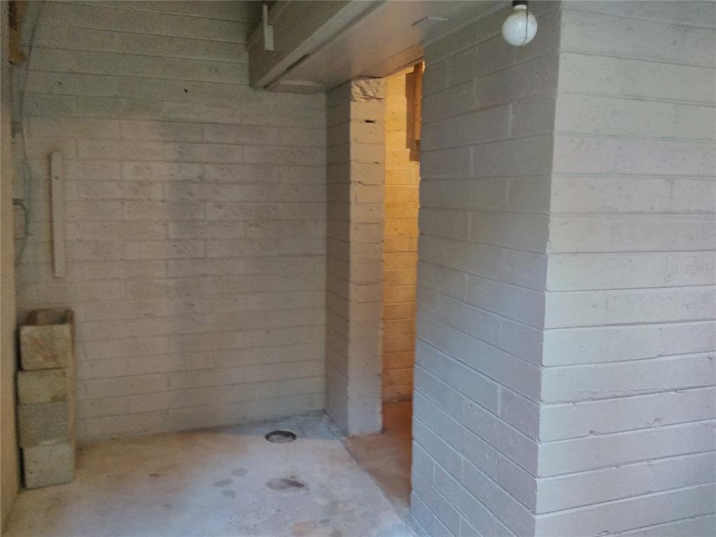 487 Rylane Street De Leon Springs, FL 32130 - Photo 32 of 40 a bathroom with a shower