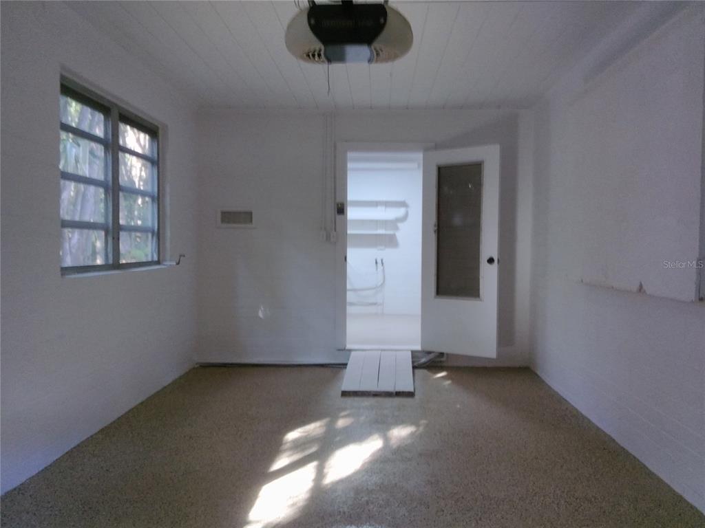 487 Rylane Street De Leon Springs, FL 32130 - Photo 34 of 40 an empty room with windows