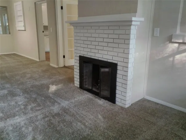 an empty room with a fireplace
