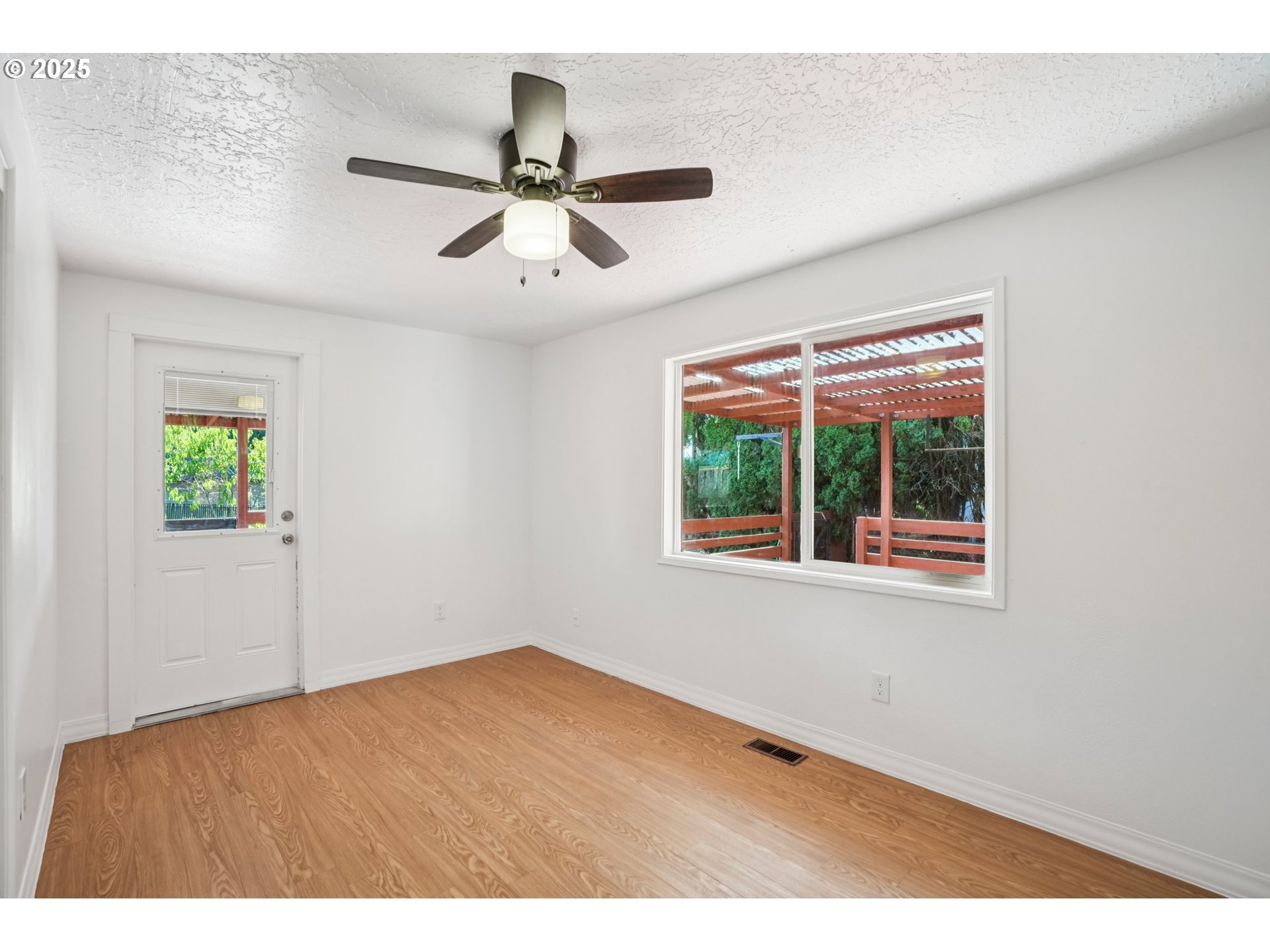 1019 Linn Avenue Oregon City, OR 97045 - Photo 16 of 27 a view of an empty room with a window