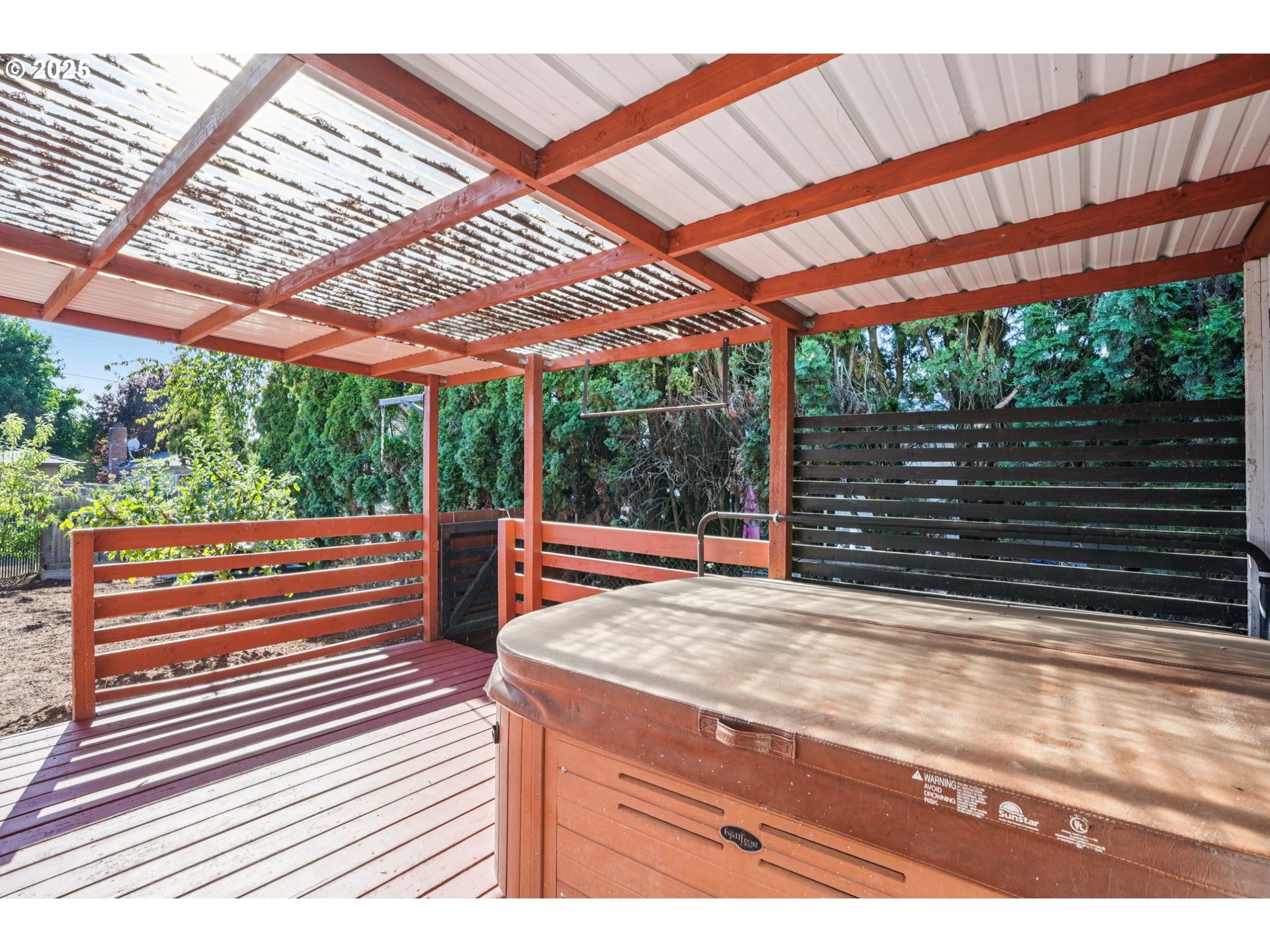 1019 Linn Avenue Oregon City, OR 97045 - Photo 17 of 27 a view of a patio with a table and chairs under an umbrella