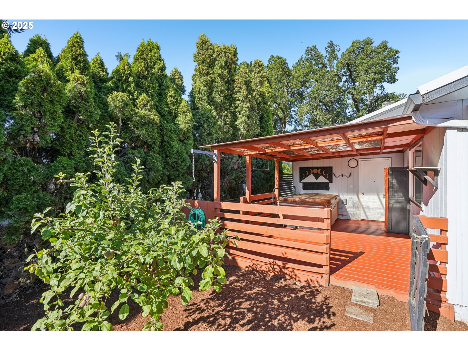 1019 Linn Avenue Oregon City, OR 97045 - Photo 20 of 27 a backyard of a house with table and chairs plants