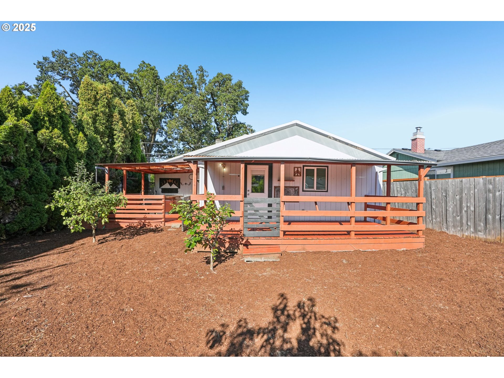 1019 Linn Avenue Oregon City, OR 97045 - Photo 22 of 27 a view of a house with backyard porch and sitting area